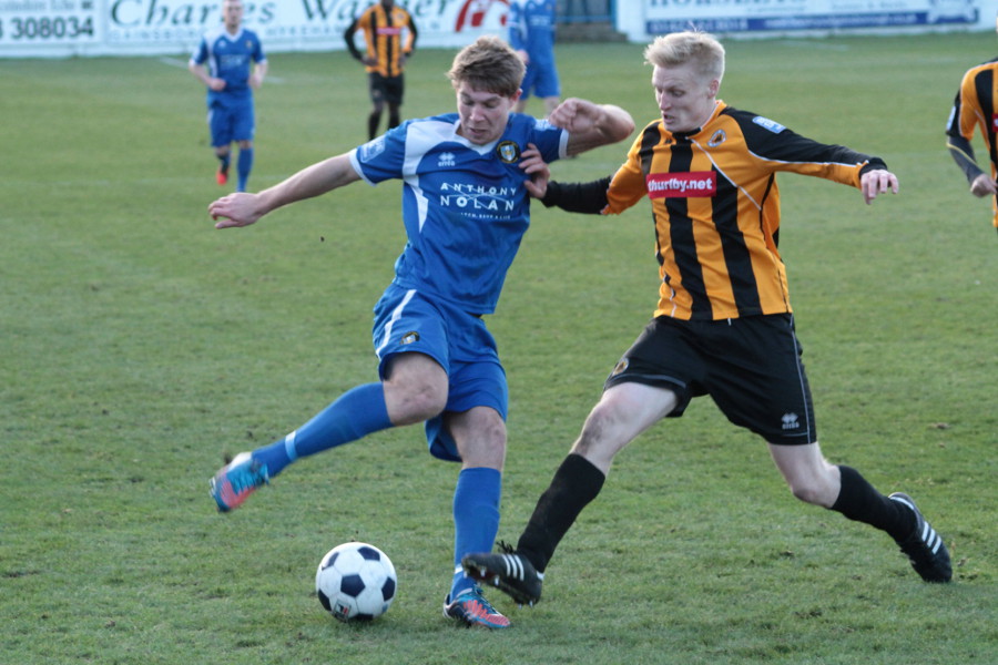 Nathan Stainfield tackles Mark Jones